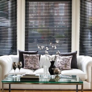 white sofa with bay windows in background