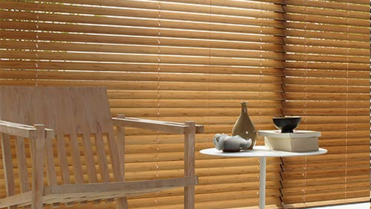 Wooden Table in Front of Wooden Blinds