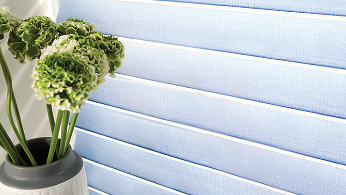 Blue Blinds with Flowers in from, within White Room
